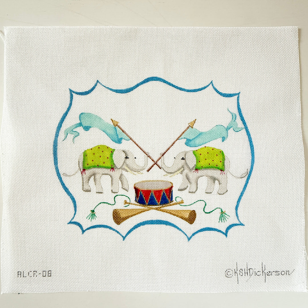 monogram crest with elephants