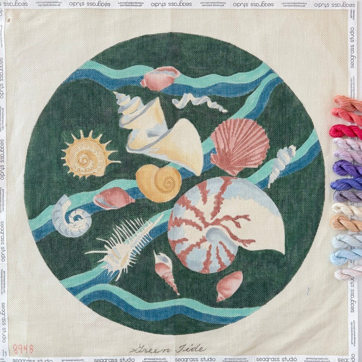 Decorative fabric panel with sea-themed design featuring shells, a sun, and waves on a white background.