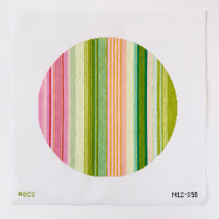 needlepoint design with vertical stripes in pink, green on a white background