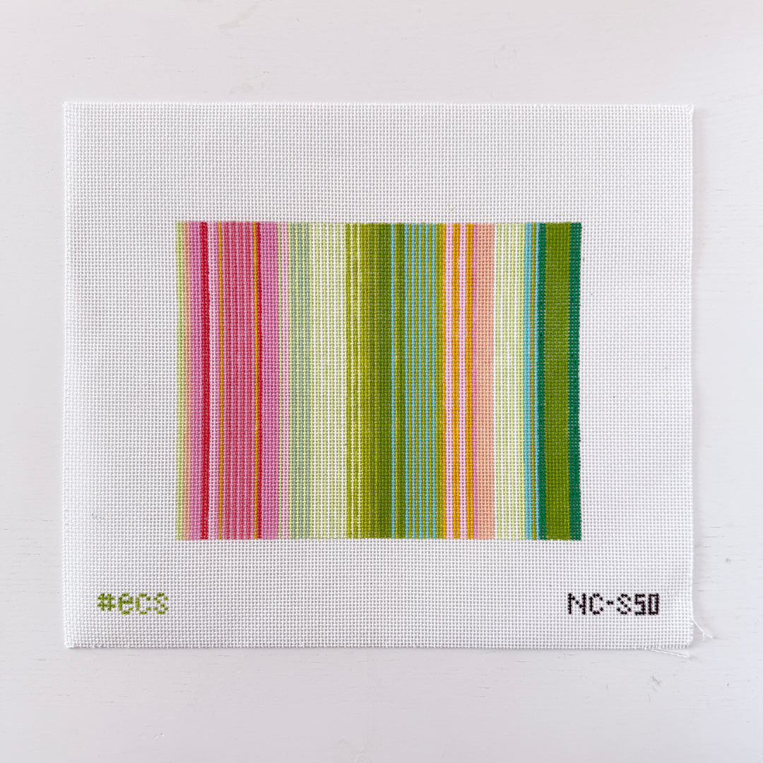 needlepoint design with horizontal stripes in various colors on a white mesh background