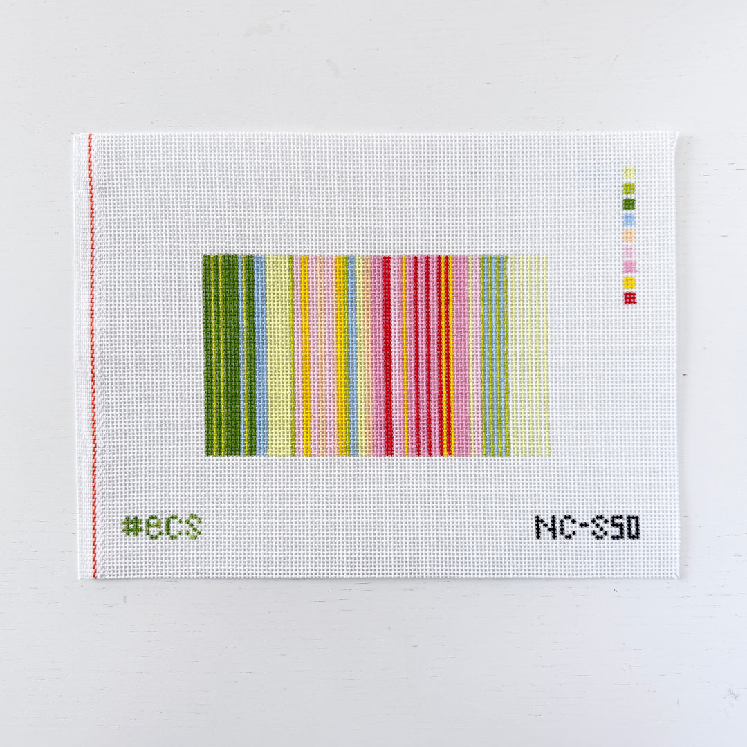 needlepoint design with striped pattern on a white mesh background